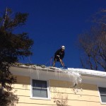 Barts Tree Service safely shoveling snow from roof