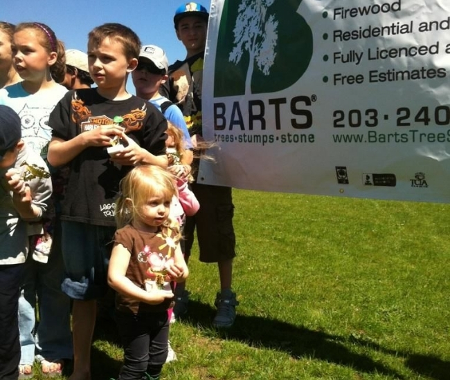 Fishing derby by barts with kids during a photo op