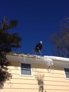 Barts tree service safely shoveling snow from roof